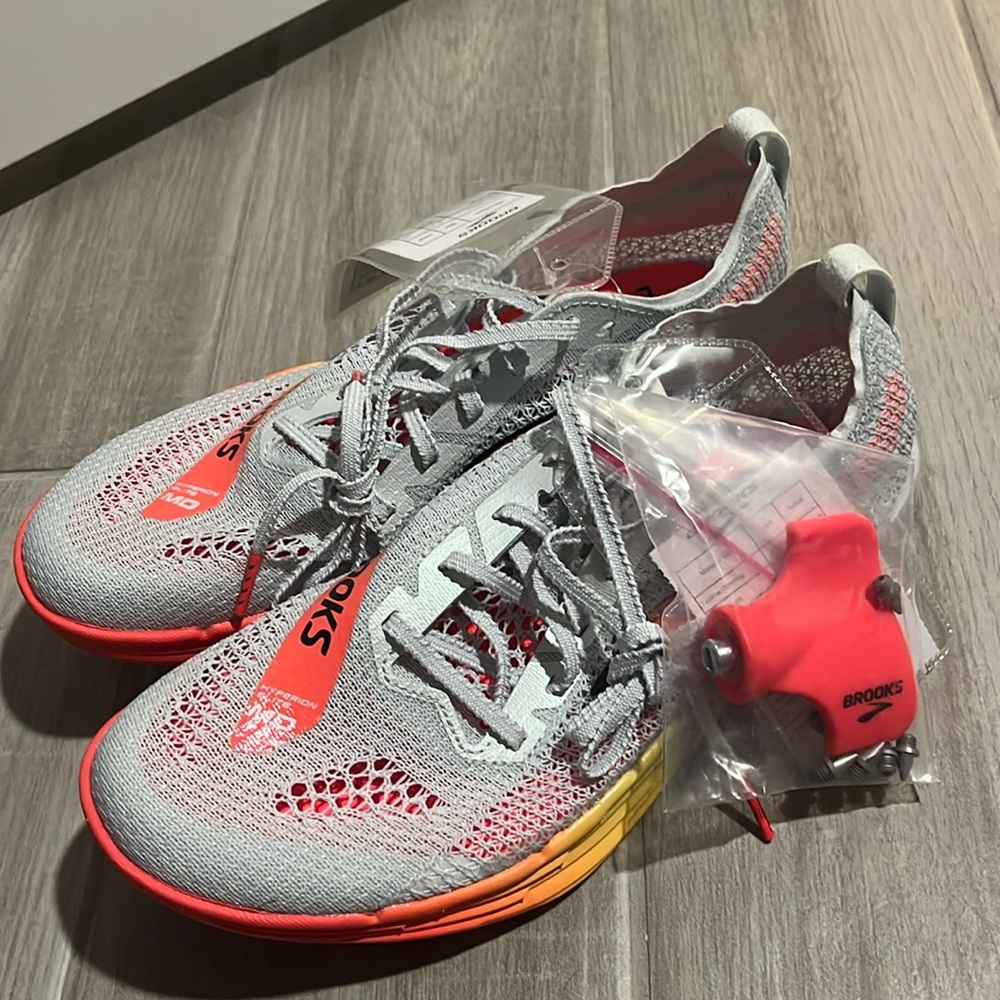 Brand new MD brooks spikes!!! Size 9 womens 7.5 in men's